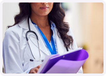 woman doctor taking notes